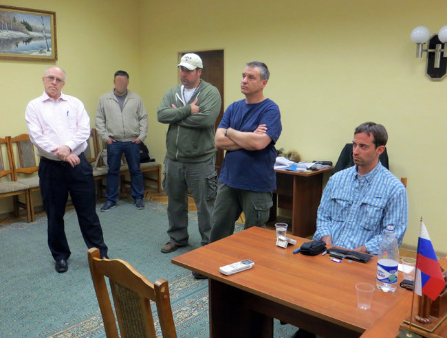 FSB photo showing alleged International Man of Mystery Ryan Christopher Fogle, seated at right.