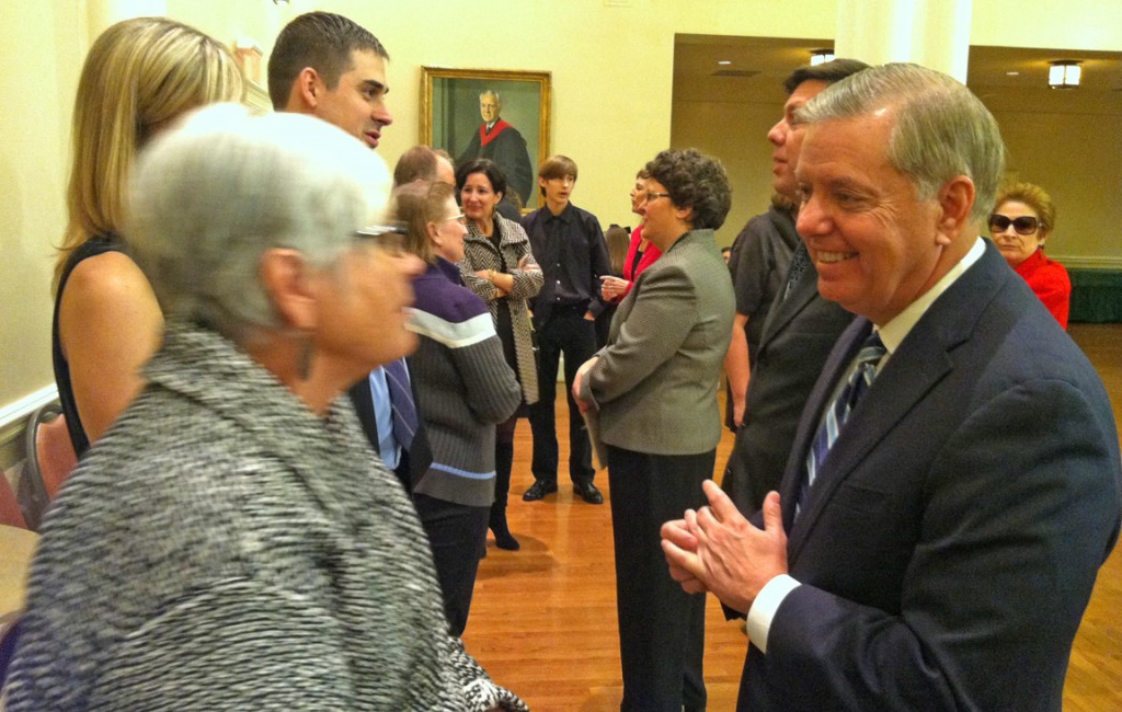 Graham, consoling the family after Lee Bandy's funeral.