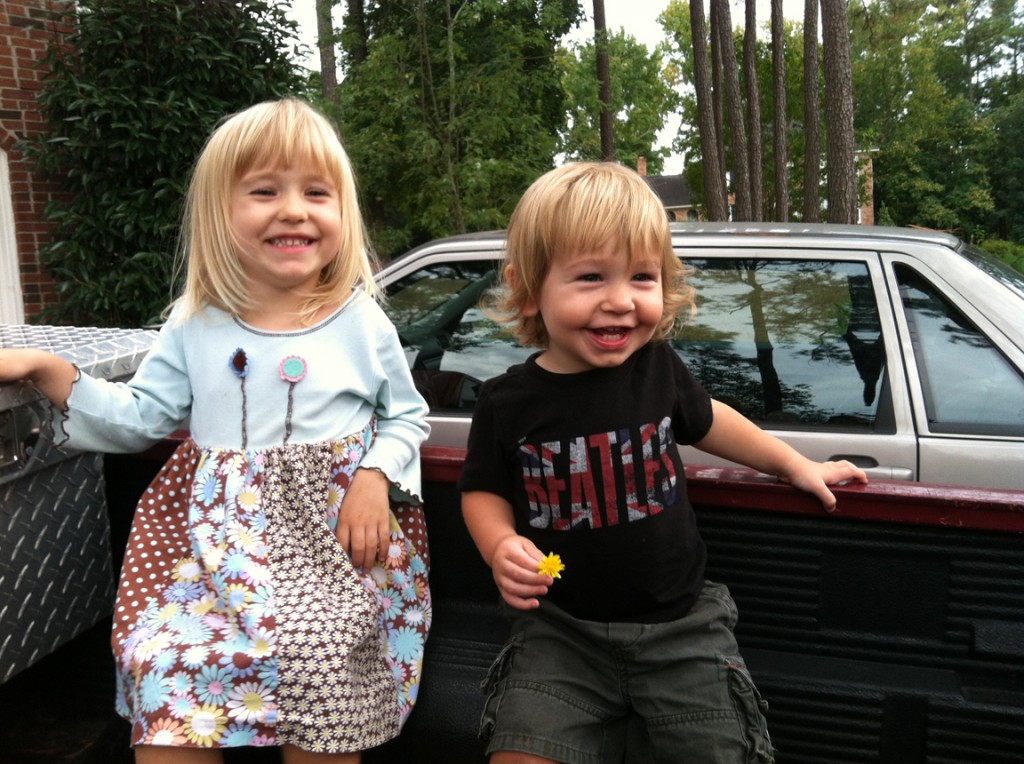 The Before look: Having a laugh with his big sister in the back of my truck a couple of weeks ago.