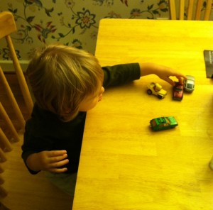 Our dedicated young engineer, carefully studying cars for rollability.