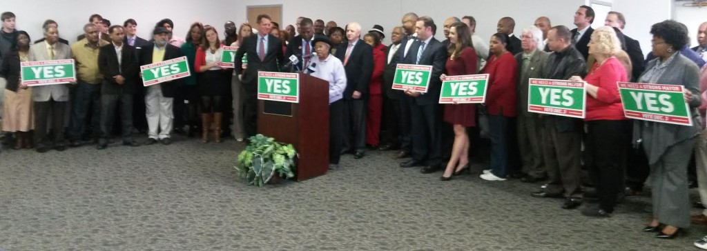 A group of neighborhood and community leaders gather to endorse strong-mayor on Monday.