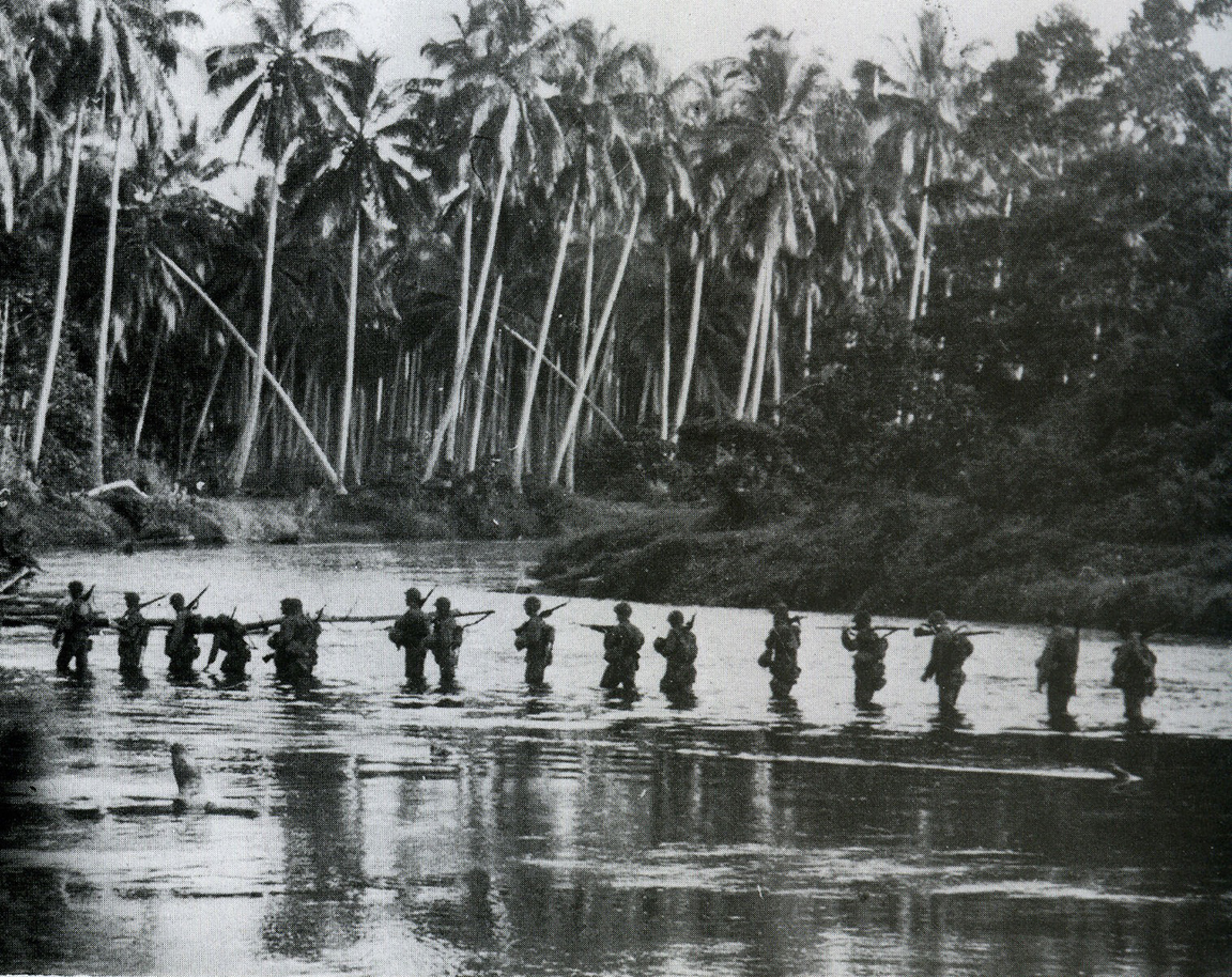 Guadalcanal: A U.S. Marine patrol crosses the Matanikau River in September 1942.