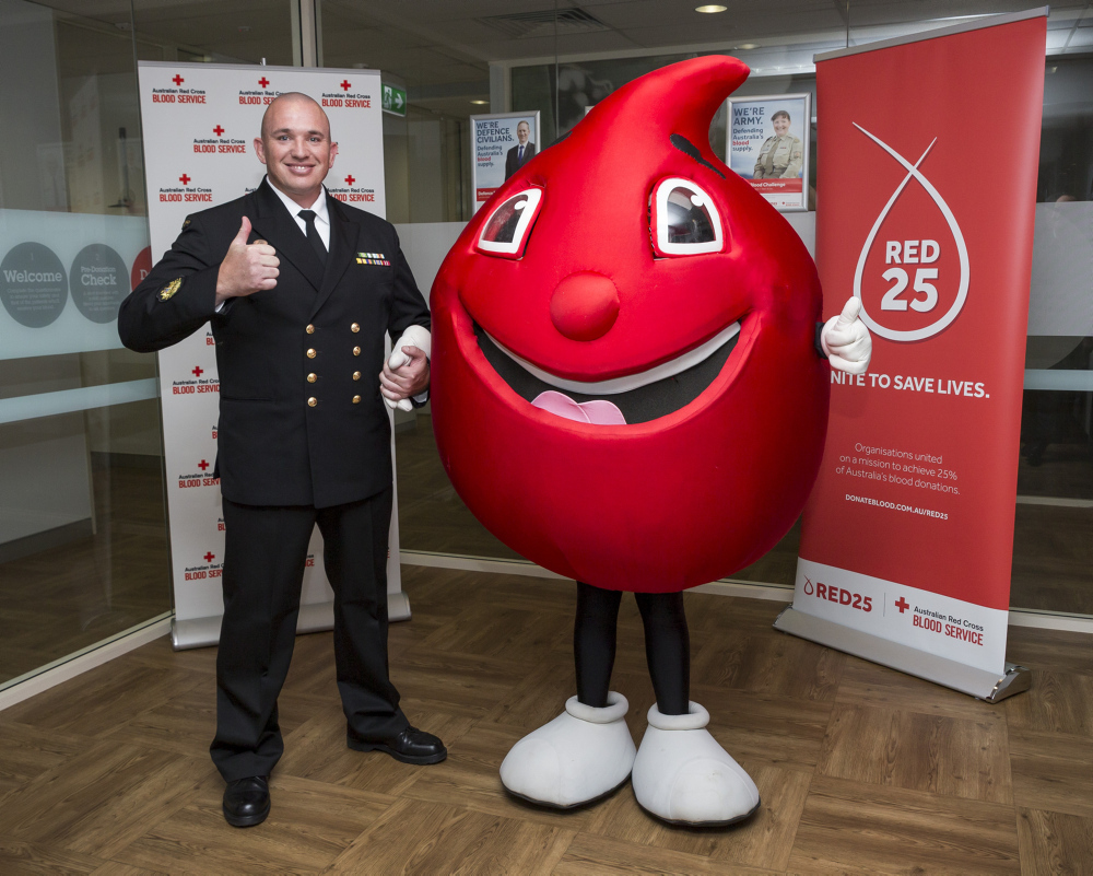 Royal Australian Navy Civilian Blood Ambassador Warrant Officer (WO) Chris Boardman with Billy the Blood drop at the 2016 Defence Blood Challenge launch, held at Red Cross Canberra Donor Centre on the 22 August, 2016. *** Local Caption *** This year marks the eighth annual Defence Blood Challenge. The Challenge is the Australian Red Cross Service's largest group challenge and targets all Australian Defence Force and Defence Public Servants and their families. Defence is part of Red25 which is a nation-wide network for organisations whose shared mission is to unite to save lives. Every Defence blood donation goes toward the tally and Red25's overall goal of contributing 25% of Australia's blood donations.