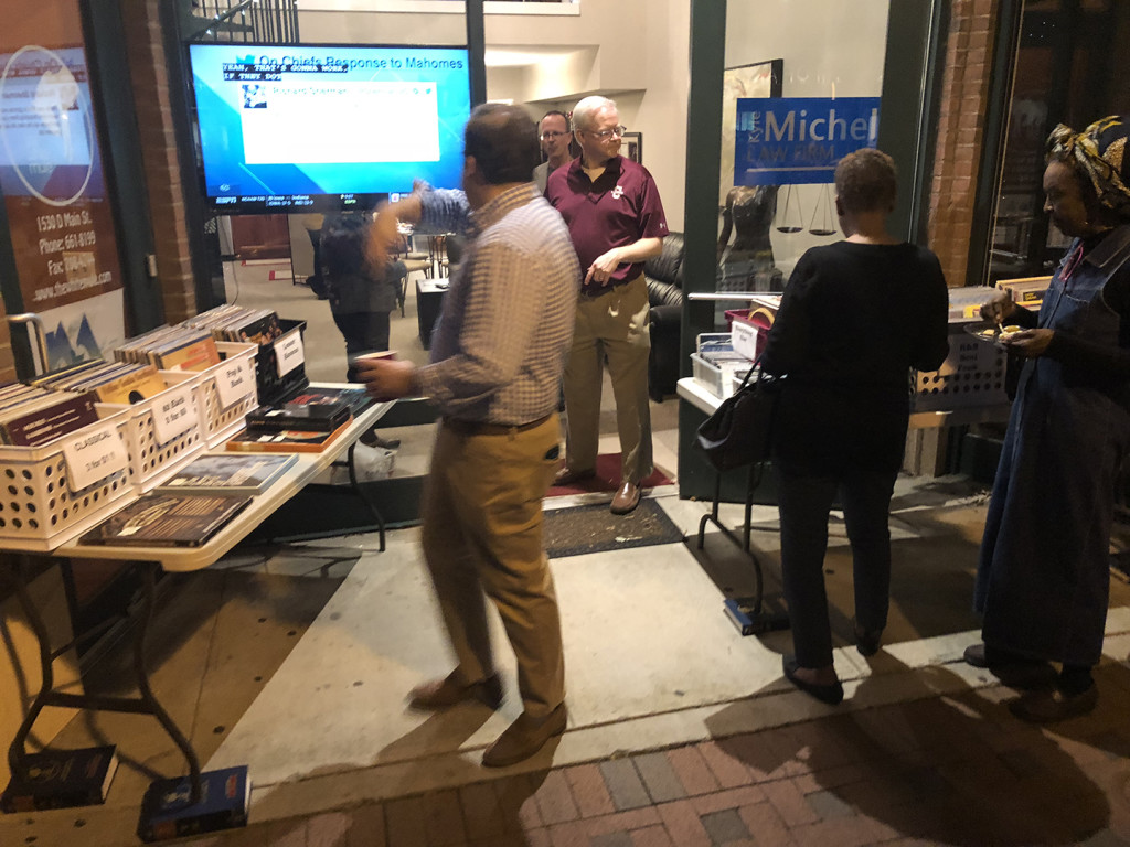 I did go check out First Thursday later. That's Kyle in the doorway in he garnet shirt. That's ex-Rep. Boyd Brown in the foreground with his head turned back.